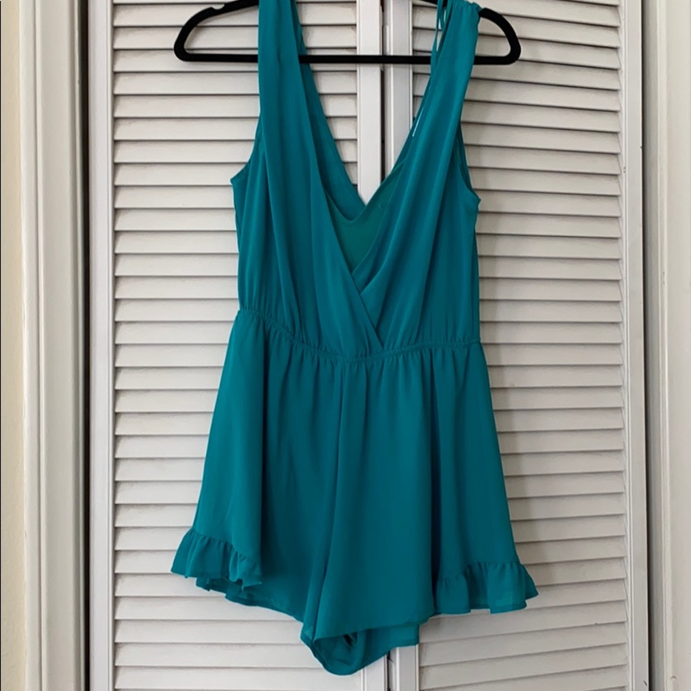 Teal romper with ruffle hem!